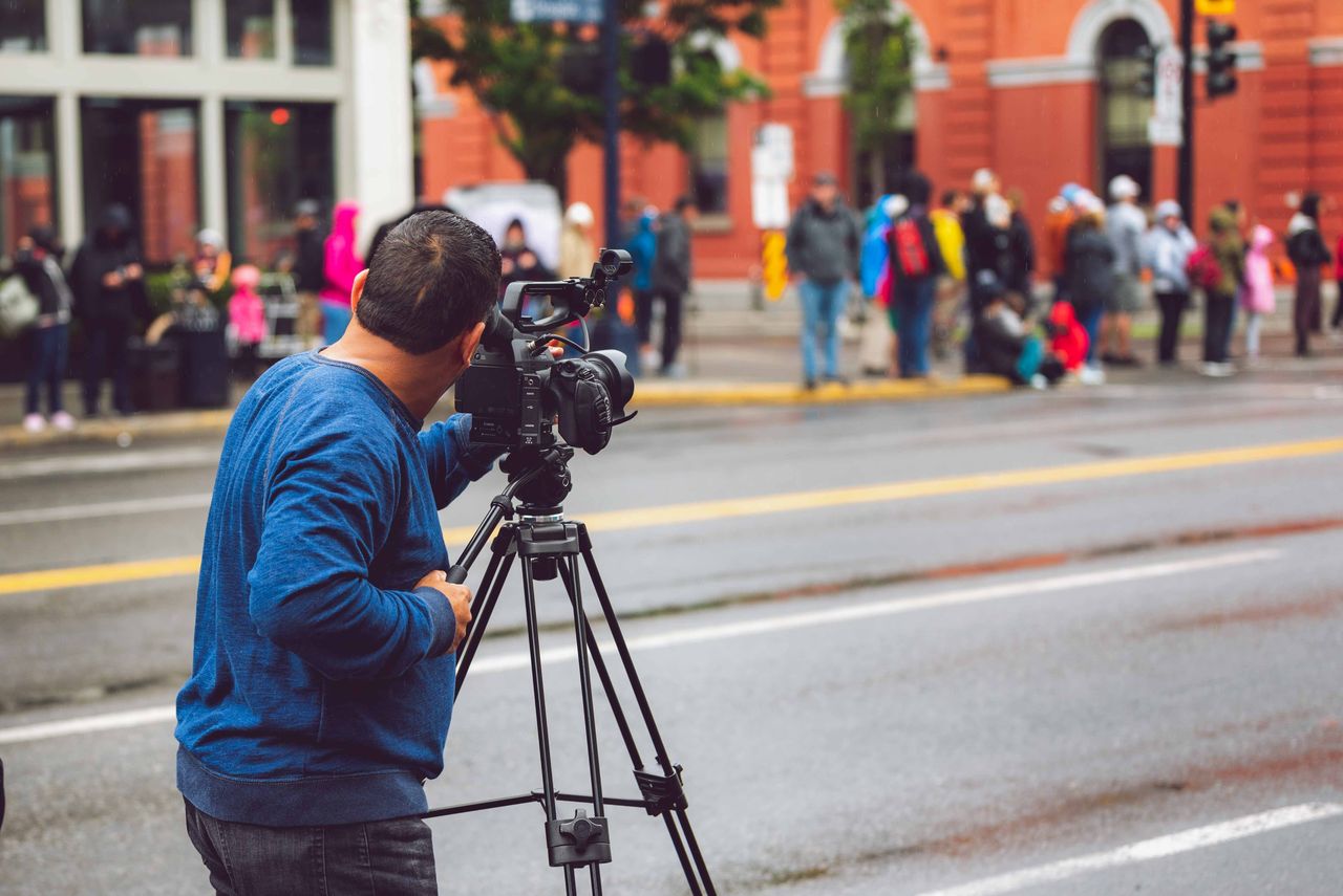 Videographer captures urban street life scene in Victoria, BC, Canada.